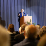 Michael Ahles addresses delegates at the 2024 Triennial Conference in Bloomington, MN