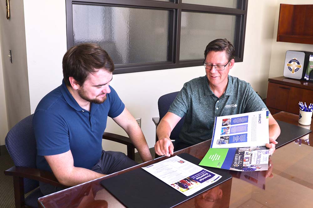 Member Advisor Tim Amireault meets with a client at our agency office in Arden Hills